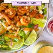 finished recipe with side of salad dressing and crispy tortilla strips.