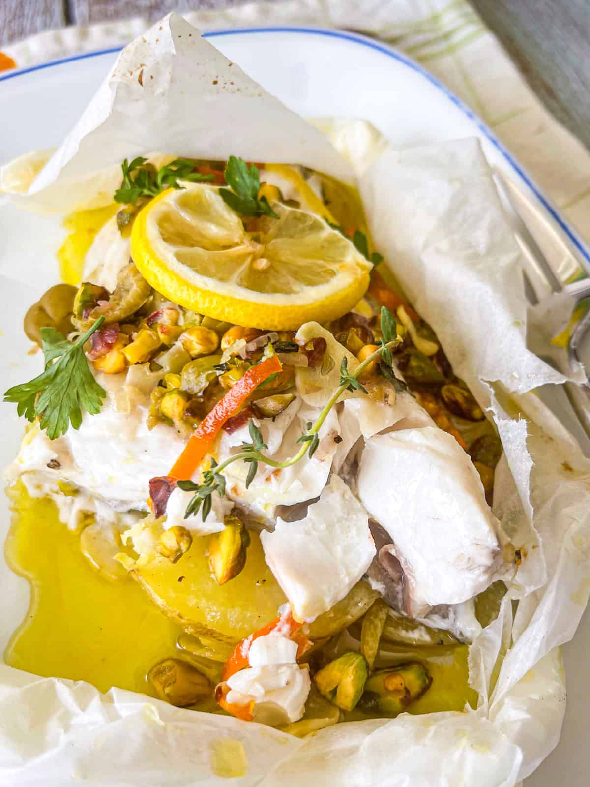 finished recipe in parchment packet.