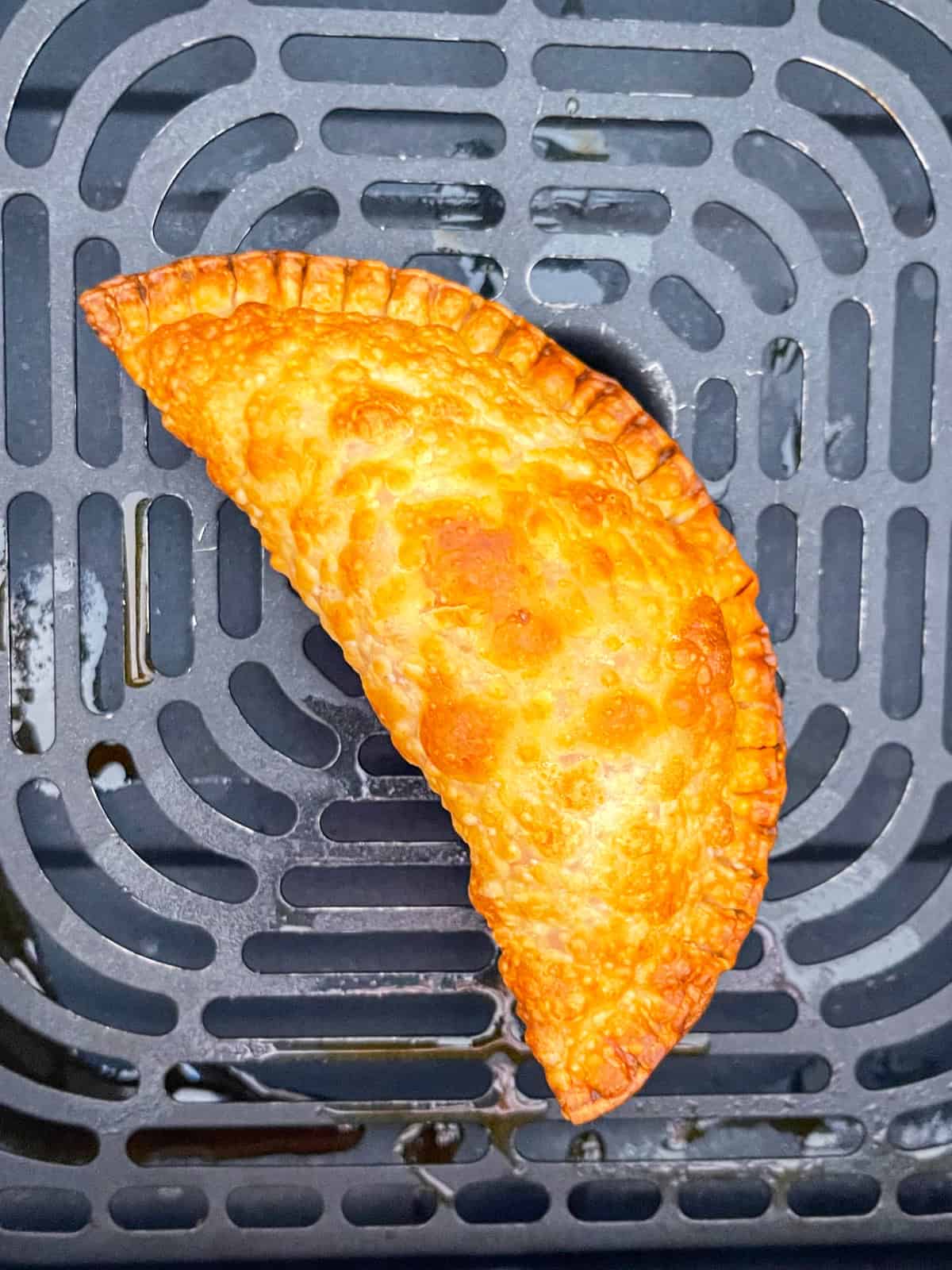 Tuna pie cooked in air fryer basket.