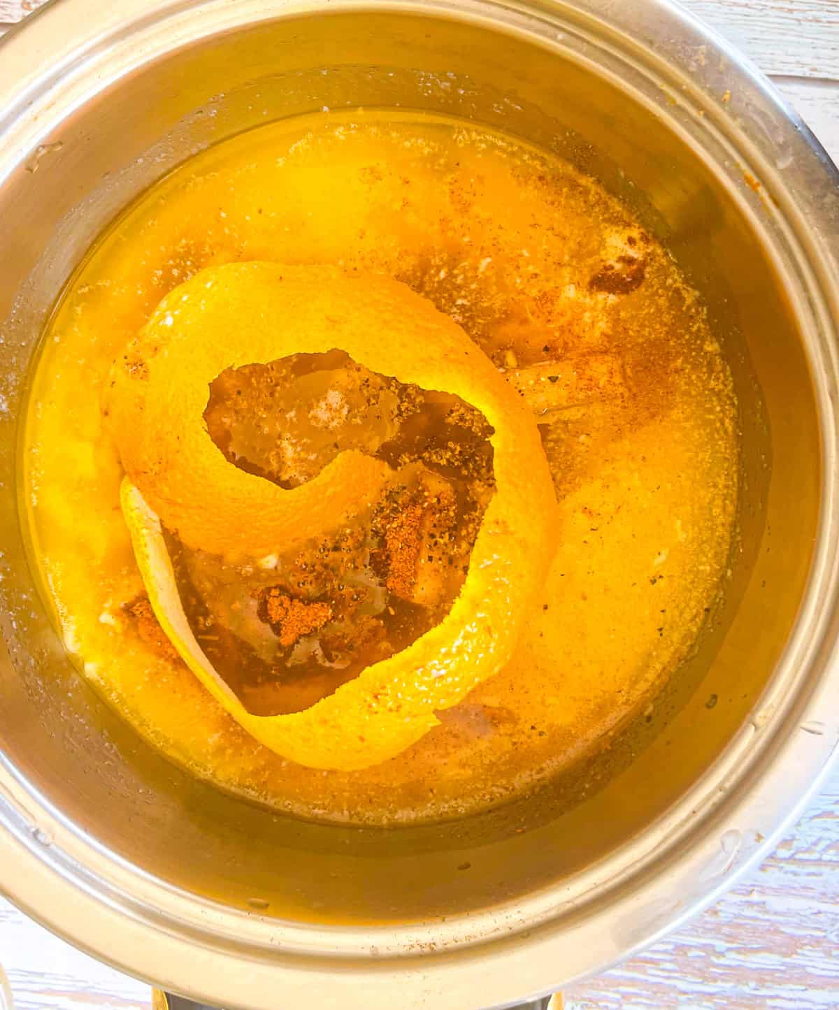 ingredients for cajun butter sauce in a saucepan on the stove.