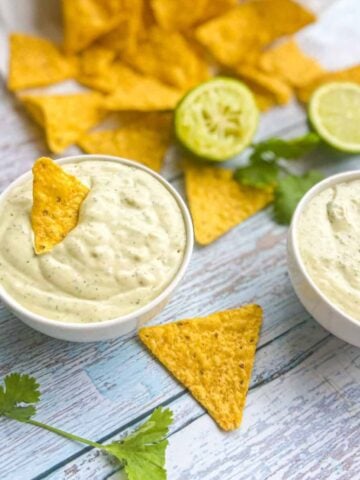 Chuy's Jalapeno Creamy DIp in two bowls with chips