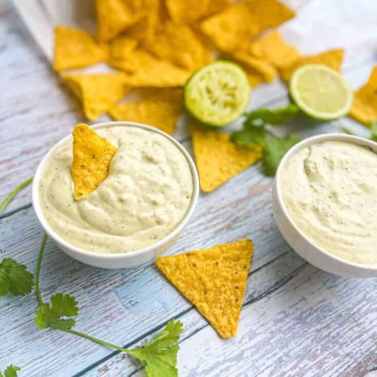Chuy's Jalapeno Creamy DIp in two bowls with chips