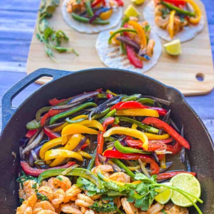 finished recipe served with shrimp in a skillet next to 3 tacos