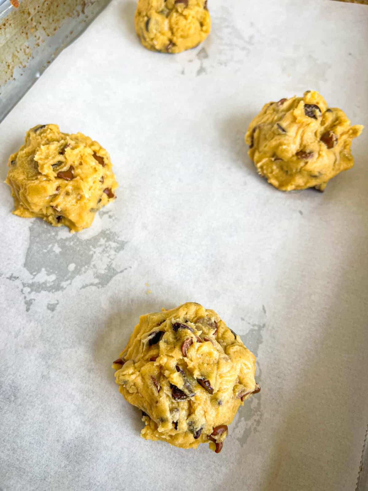 balls of chocolate chip dough on a pan