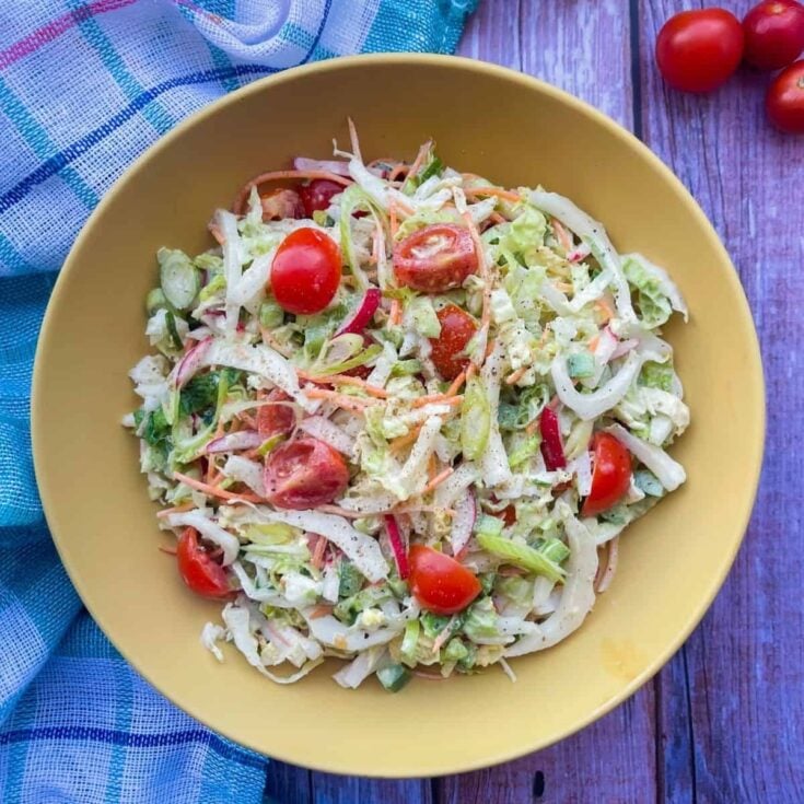 finished recipe piled high in a bowl and garnished with grape tomatoes