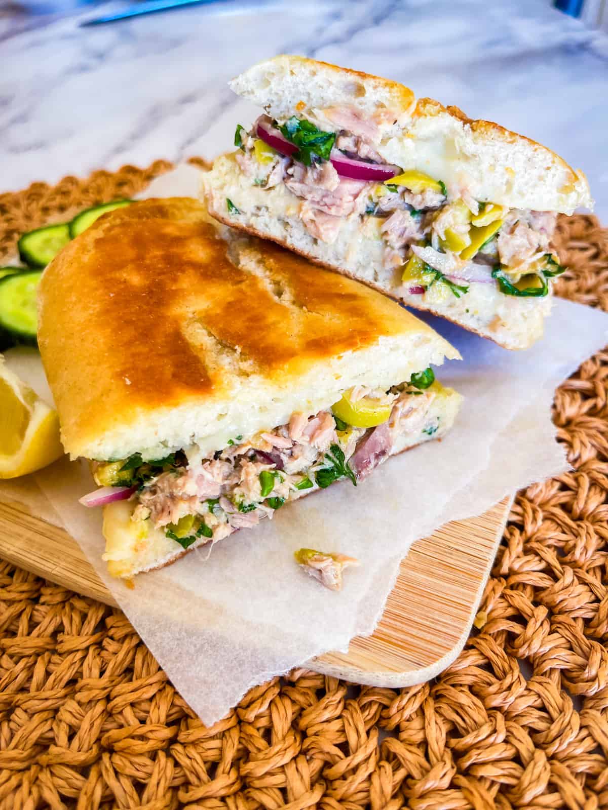 Mediterranean Tuna melt cut in half on a plate