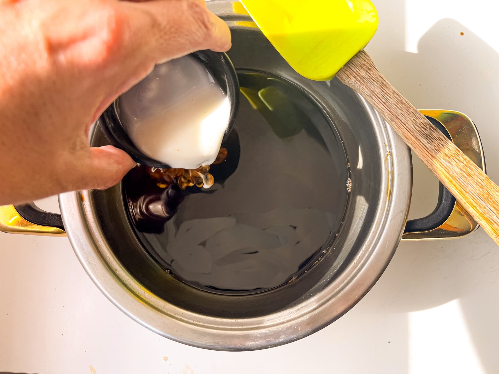 slurry poured into teriyaki sauce for thickening