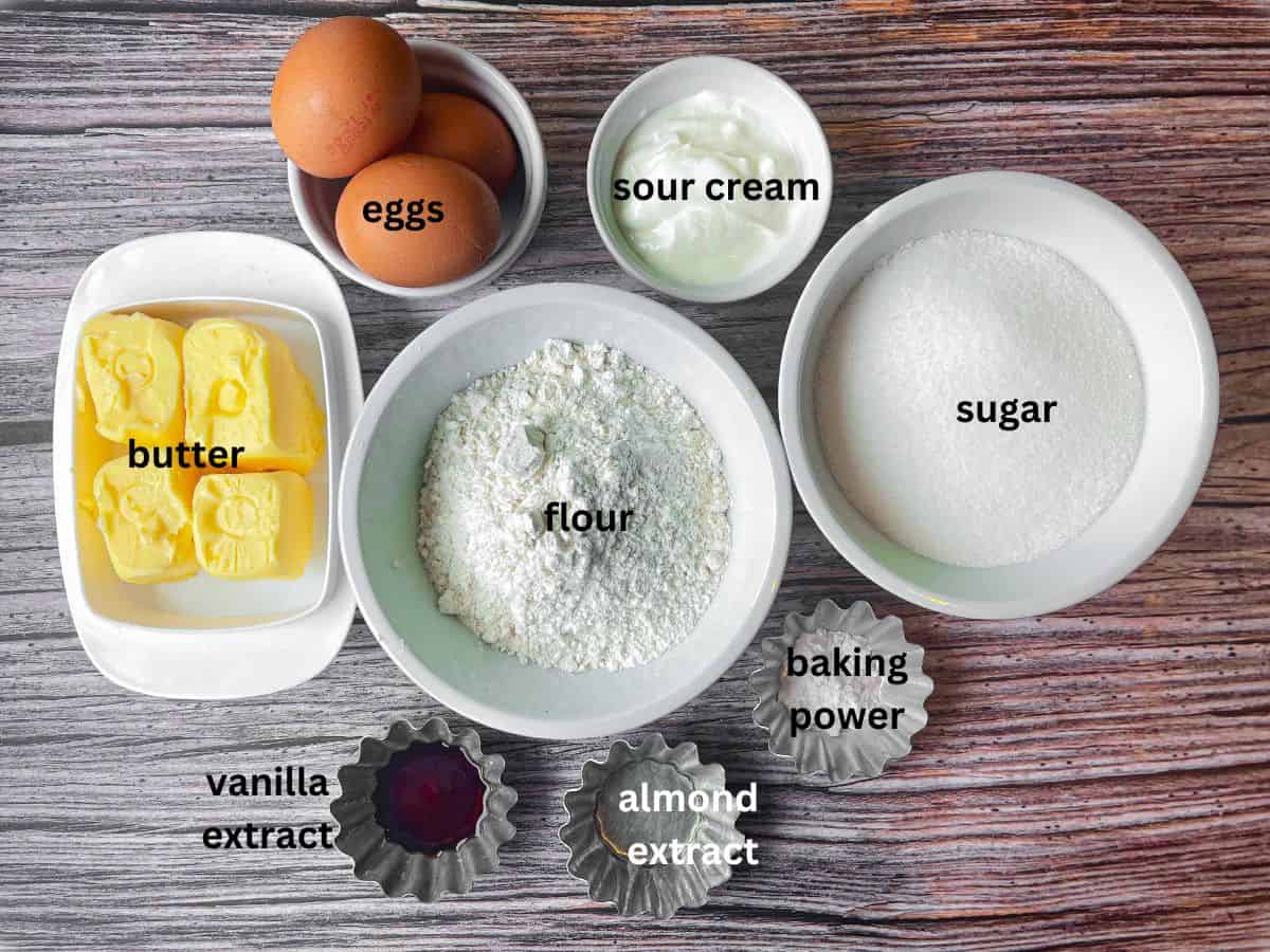 Ingredients for pound cake laid on table.