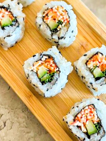 tray of spicy crab roll sushi.