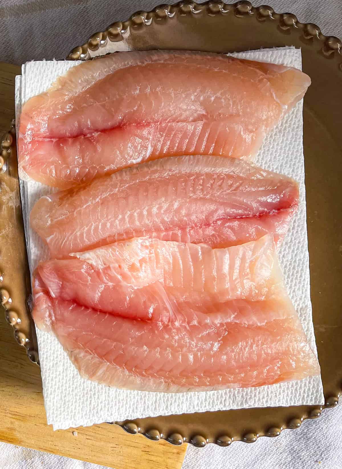 Tilapia on a paper towel.