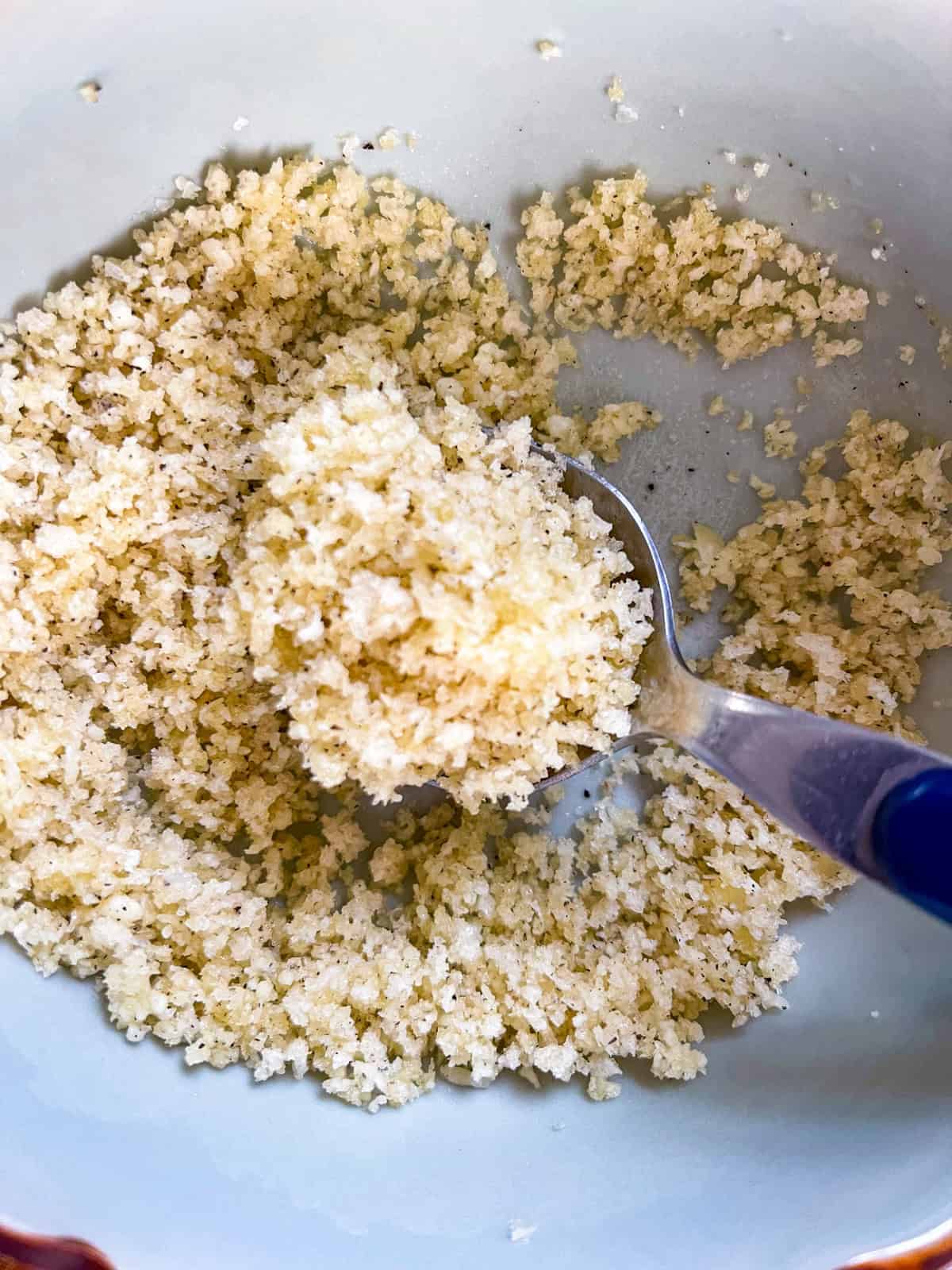 panko crumbs seasoned and mixed with parmesan in a bowl.
