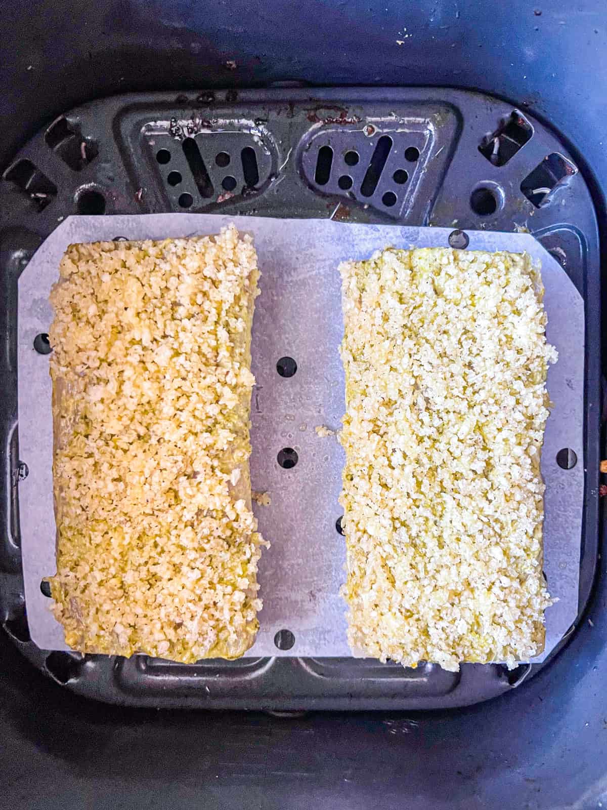 two Mahi Mahi fillets in air fryer.