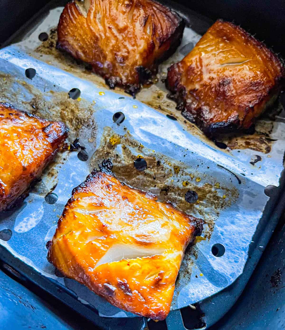 4 pieces of black cod cooked in a air fryer.