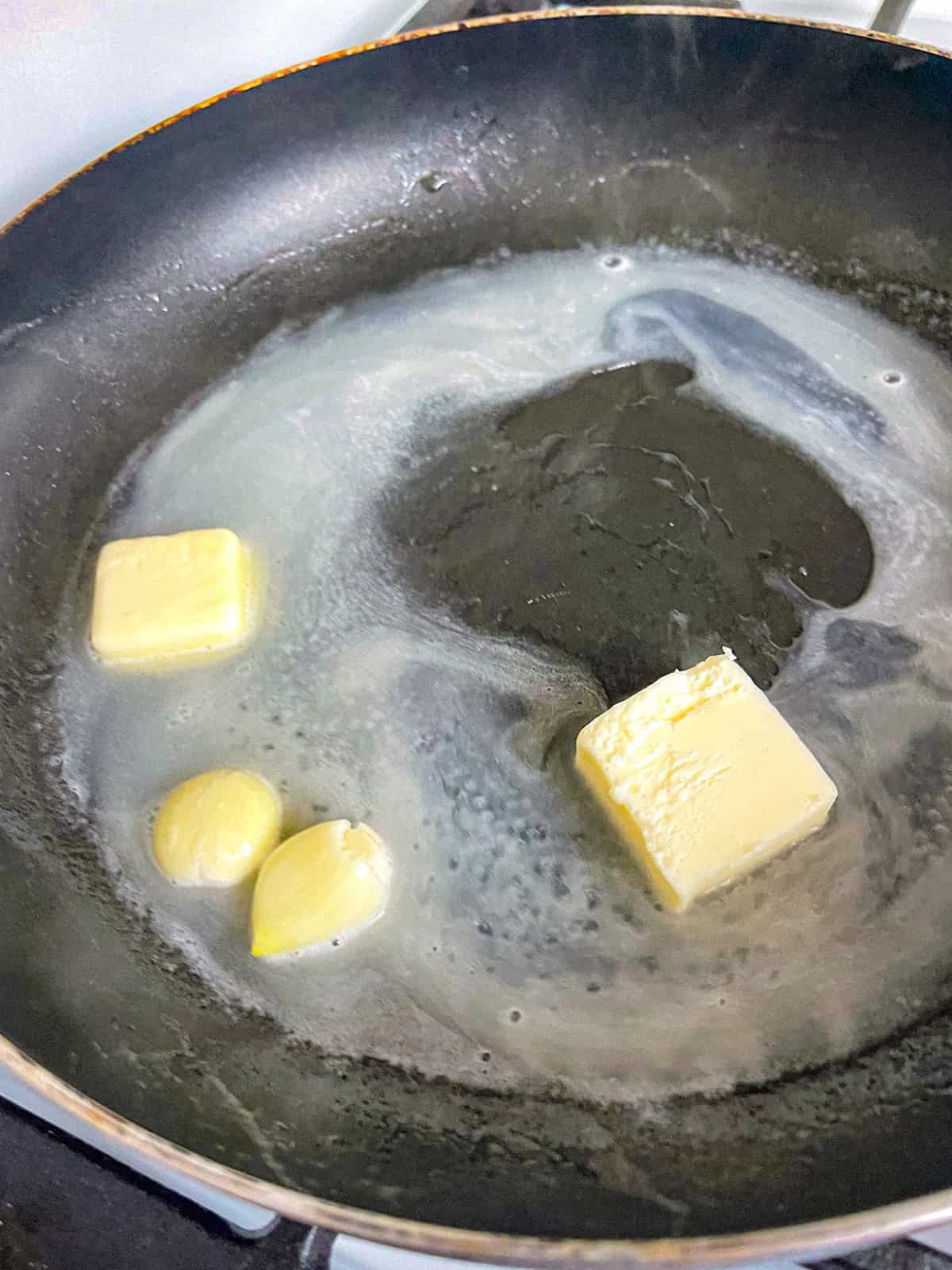Butter, garlic and water cooked in a pan