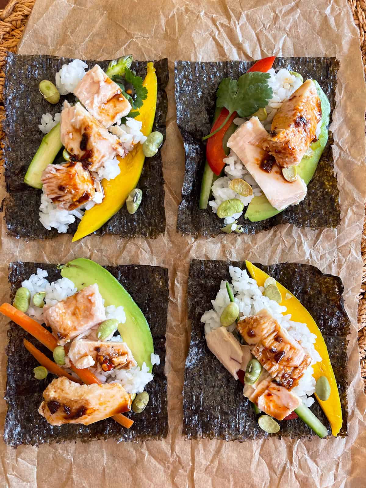 Sushi topping on rice and nori wrap.