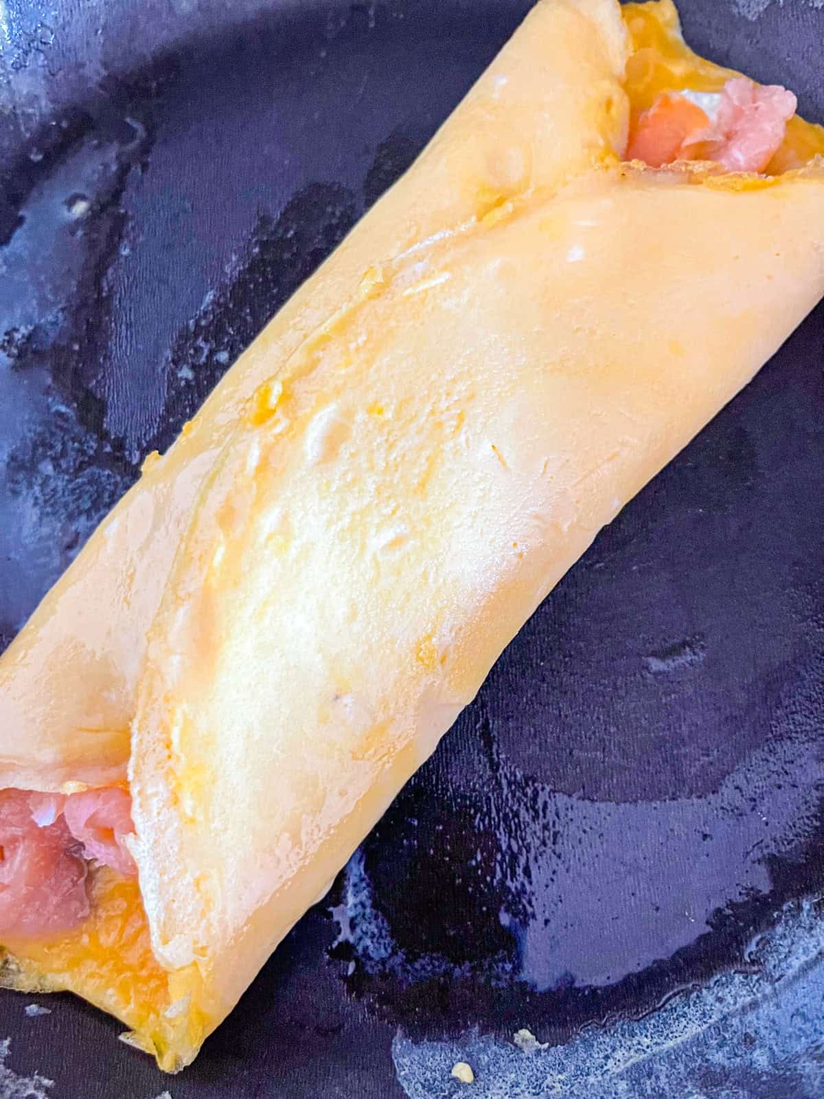 salmon omellete in a pan.