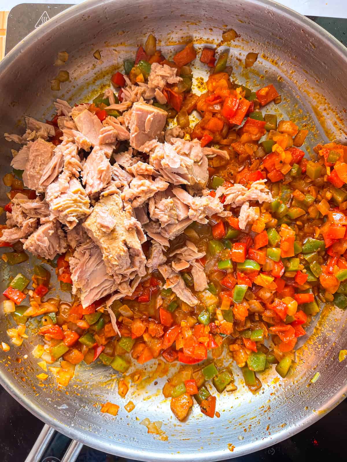 tuna and fresh lemon juice added to pan.