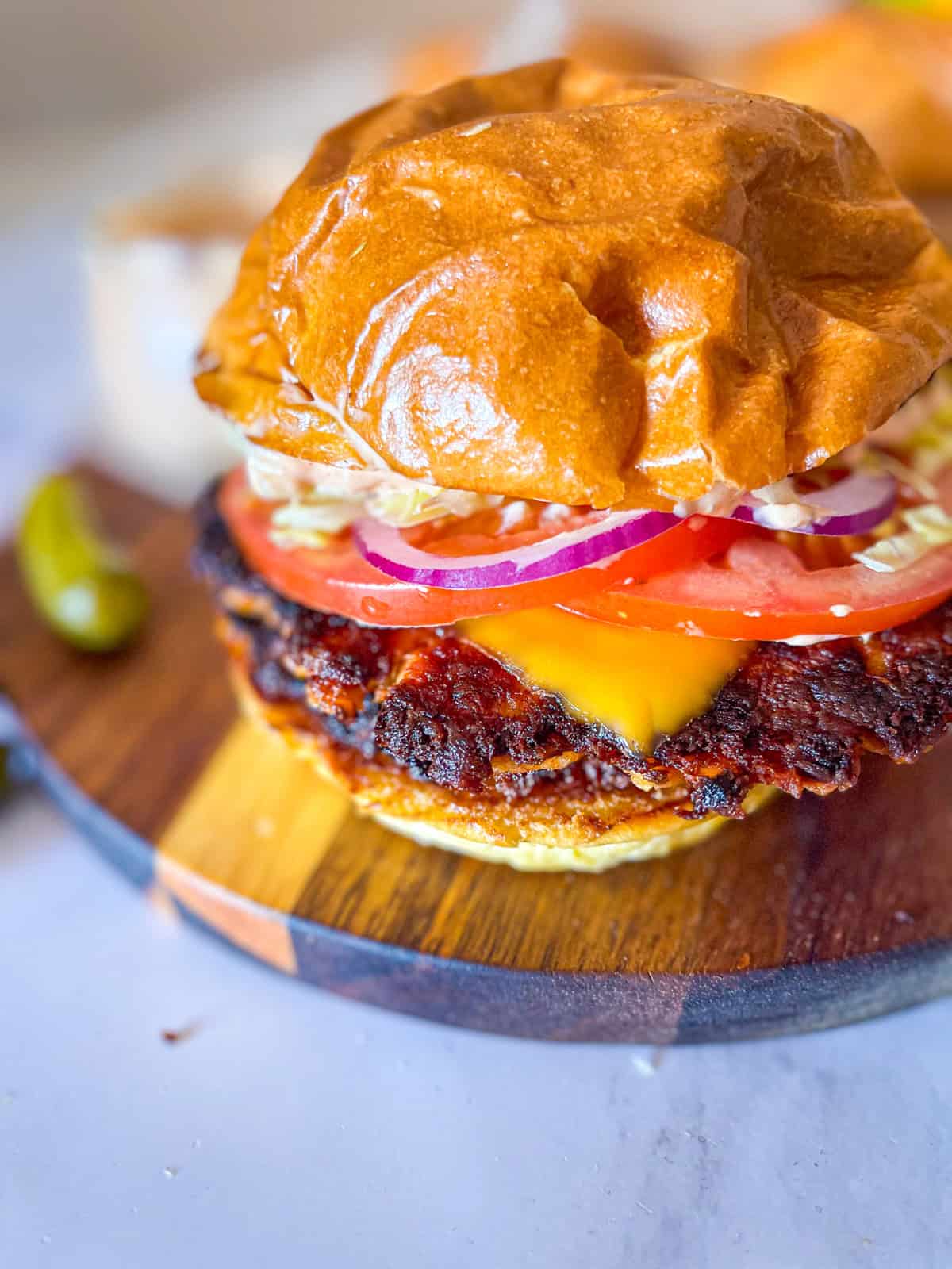 salmon smash burger using canned salmon with cheese, lettuce, tomato, onion and burger sauce.