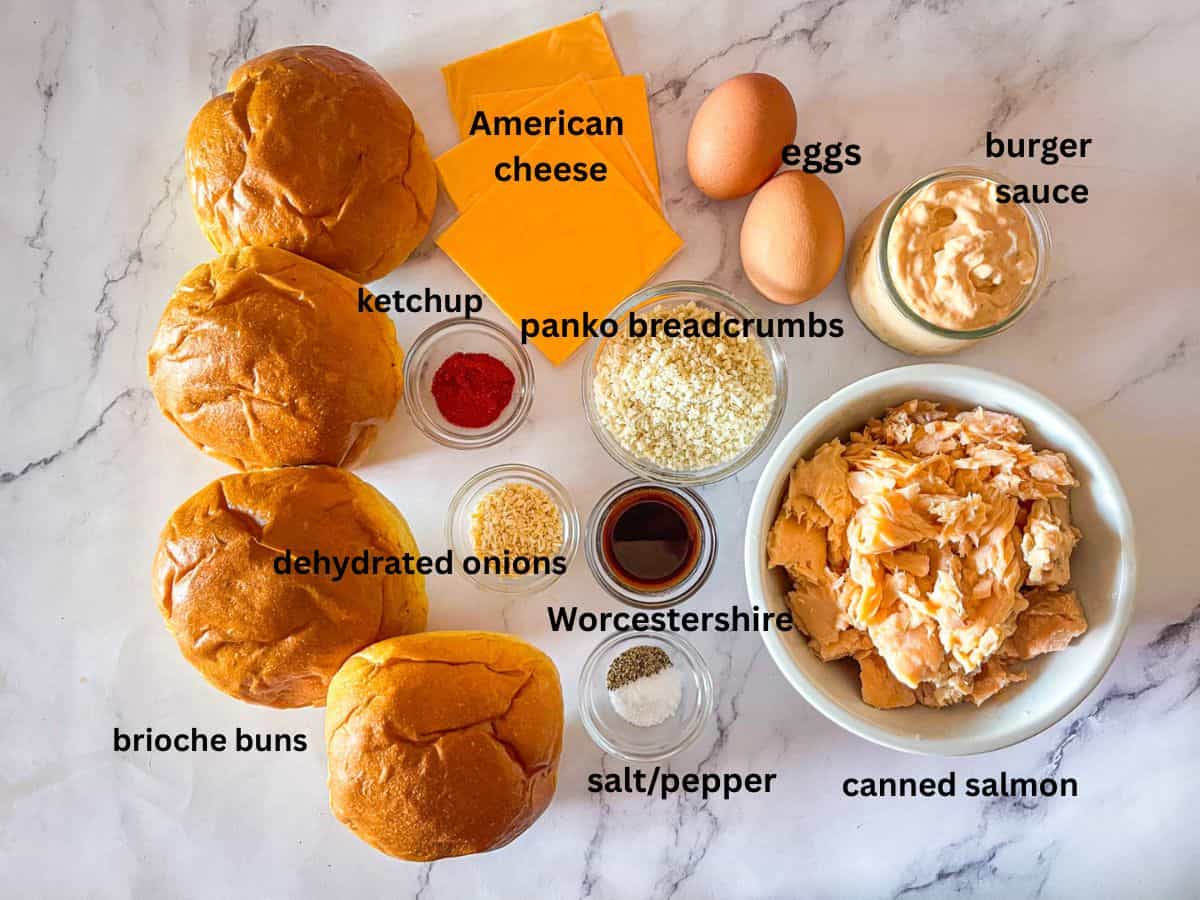 Ingredients for salmon burger on a table.