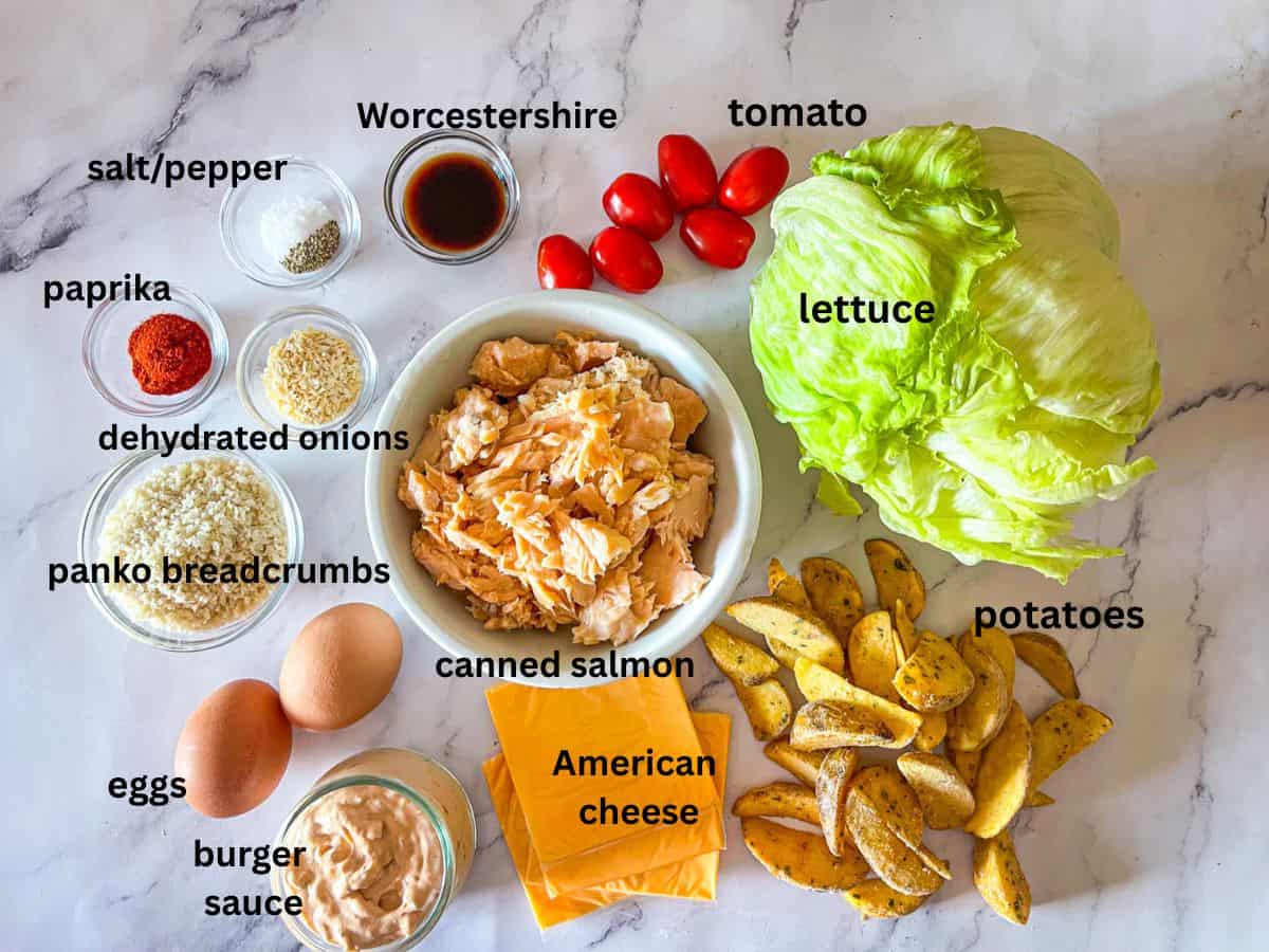Ingredients for salmon burger on a table.