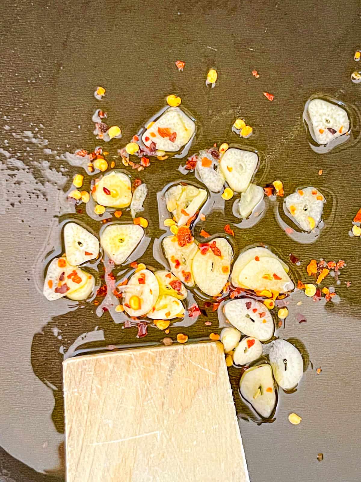 Garlic and red pepper flakes sauteed in oil.