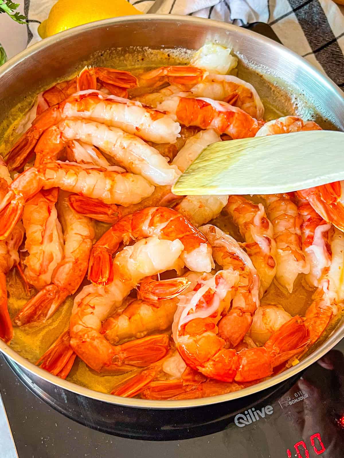 Shrimp added to skillet.