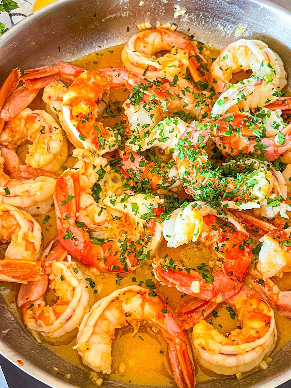 Lemon and diced parsley added to skillet.
