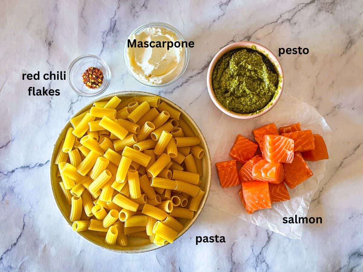 Ingredients for Pesto Salmon with Pasta on table.