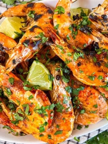 Grilled prawn with chili honey butter on a platter.