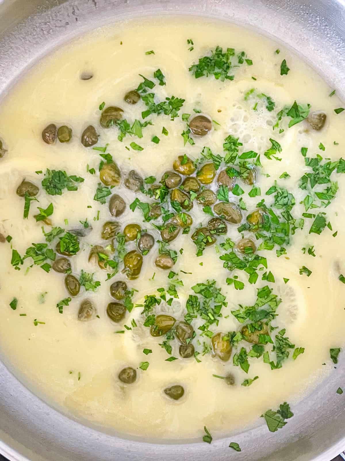 Piccata sauce in a pan.