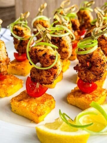 shrimp and grits bite on a serving platter.