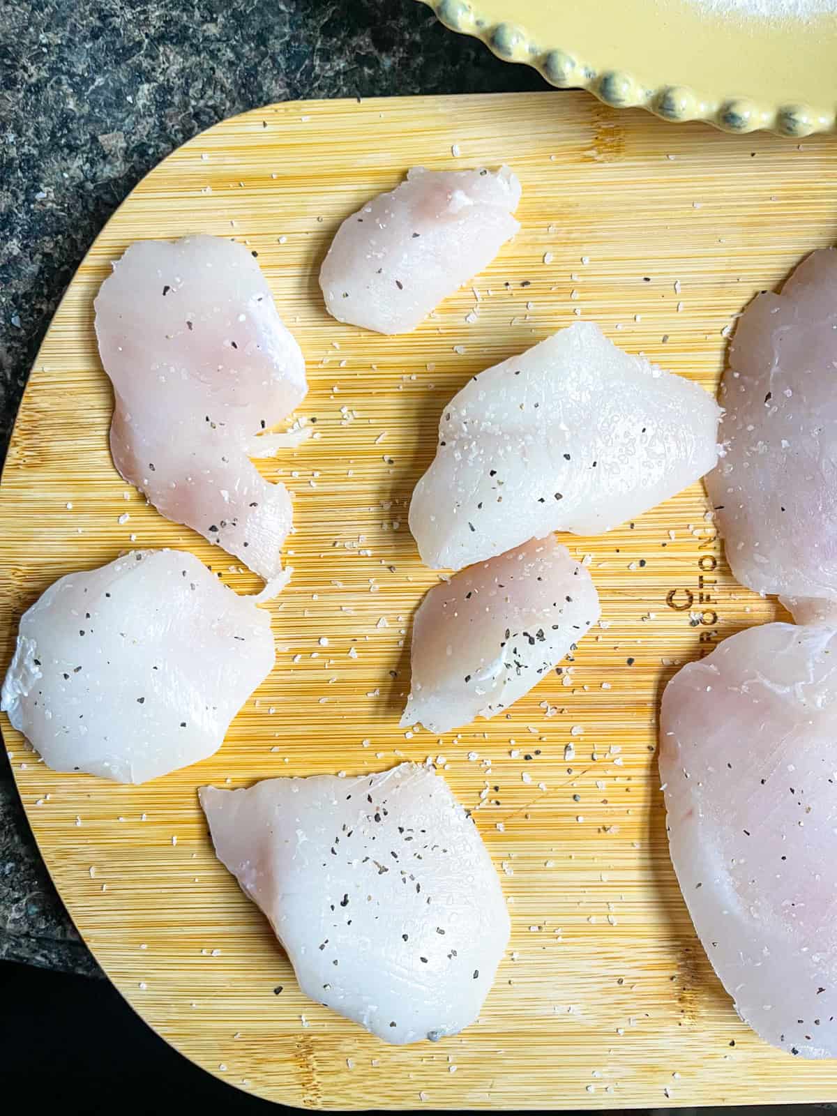 Halibut cheeks dried and seasoned with salt and pepper.
