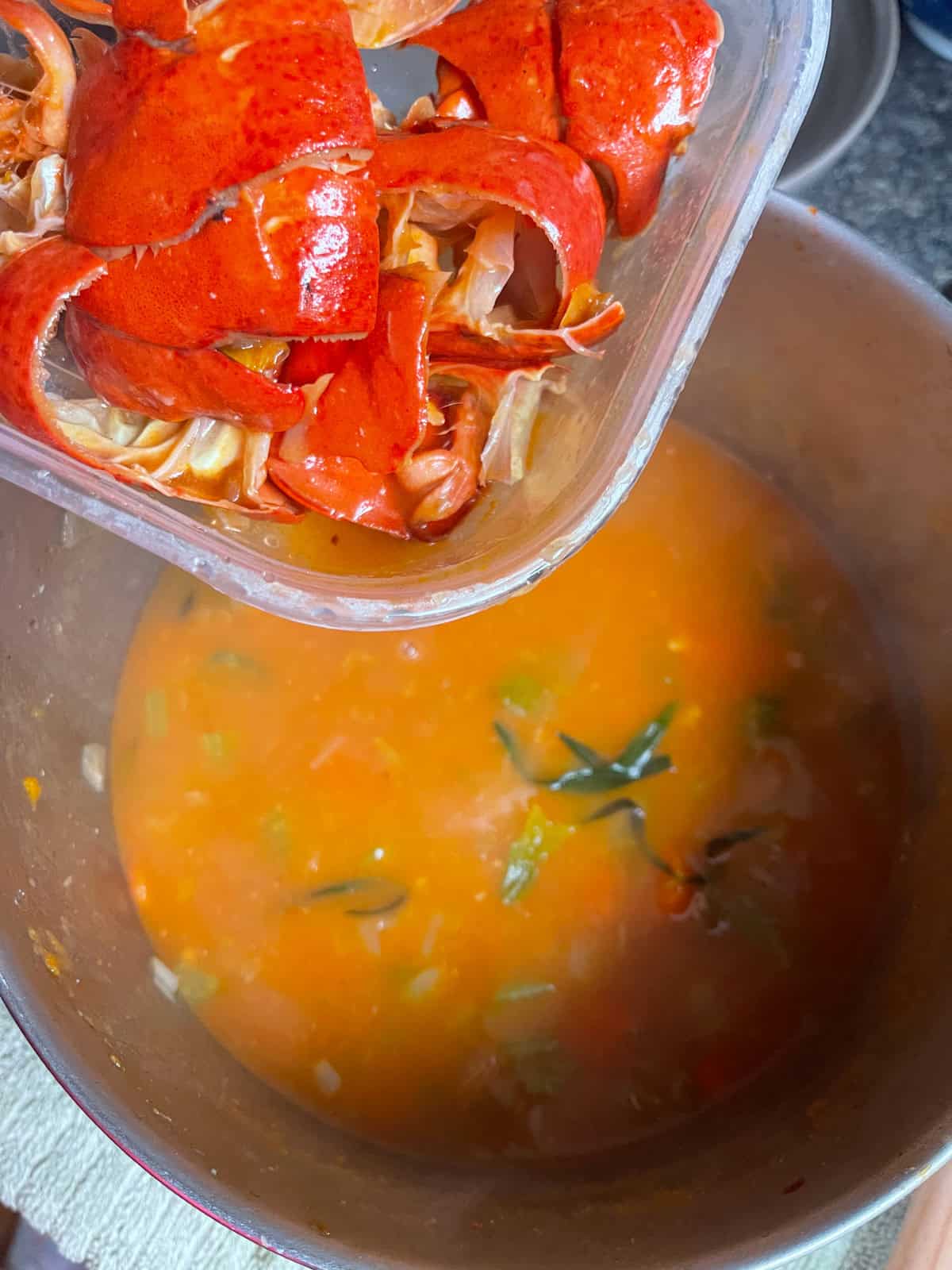 After simmering with stock and tarragon, remove large shell pieces before blending until completely smooth.