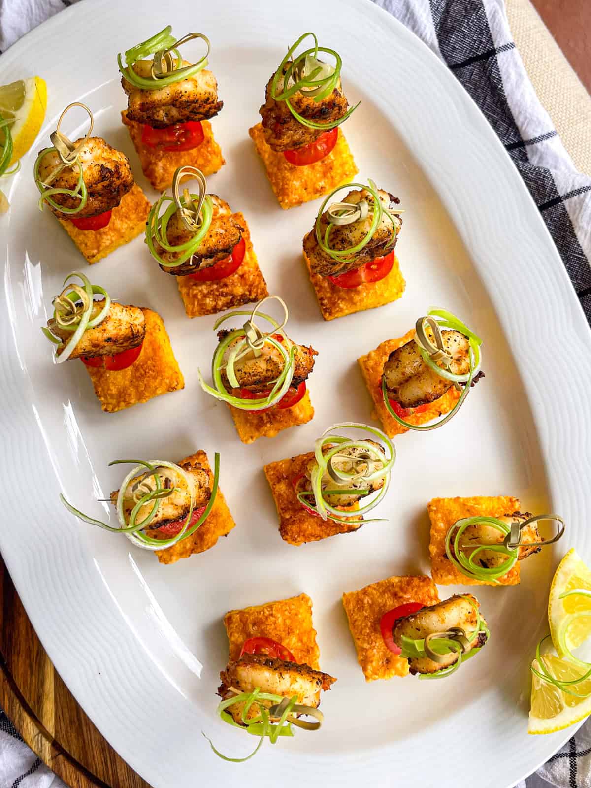 shrimp and grits bite on a serving platter.