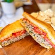 tuna melt stacked on a board.
