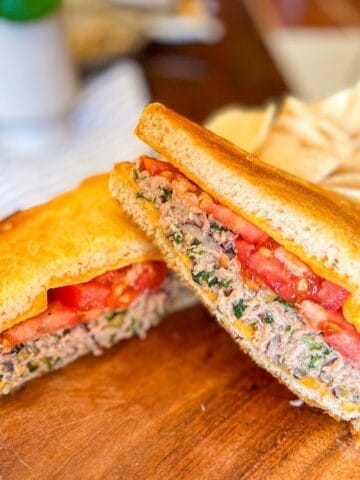 tuna melt stacked on a board.