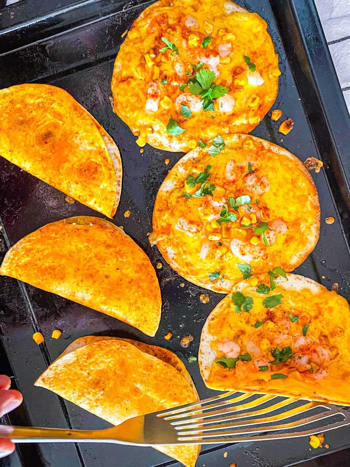 Shrimp quesadillas folded into halves.