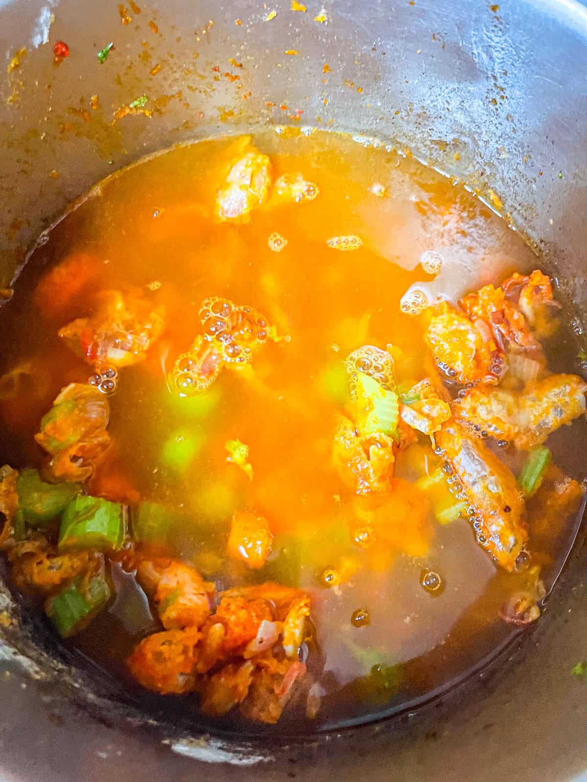 Stock added to vegetables.