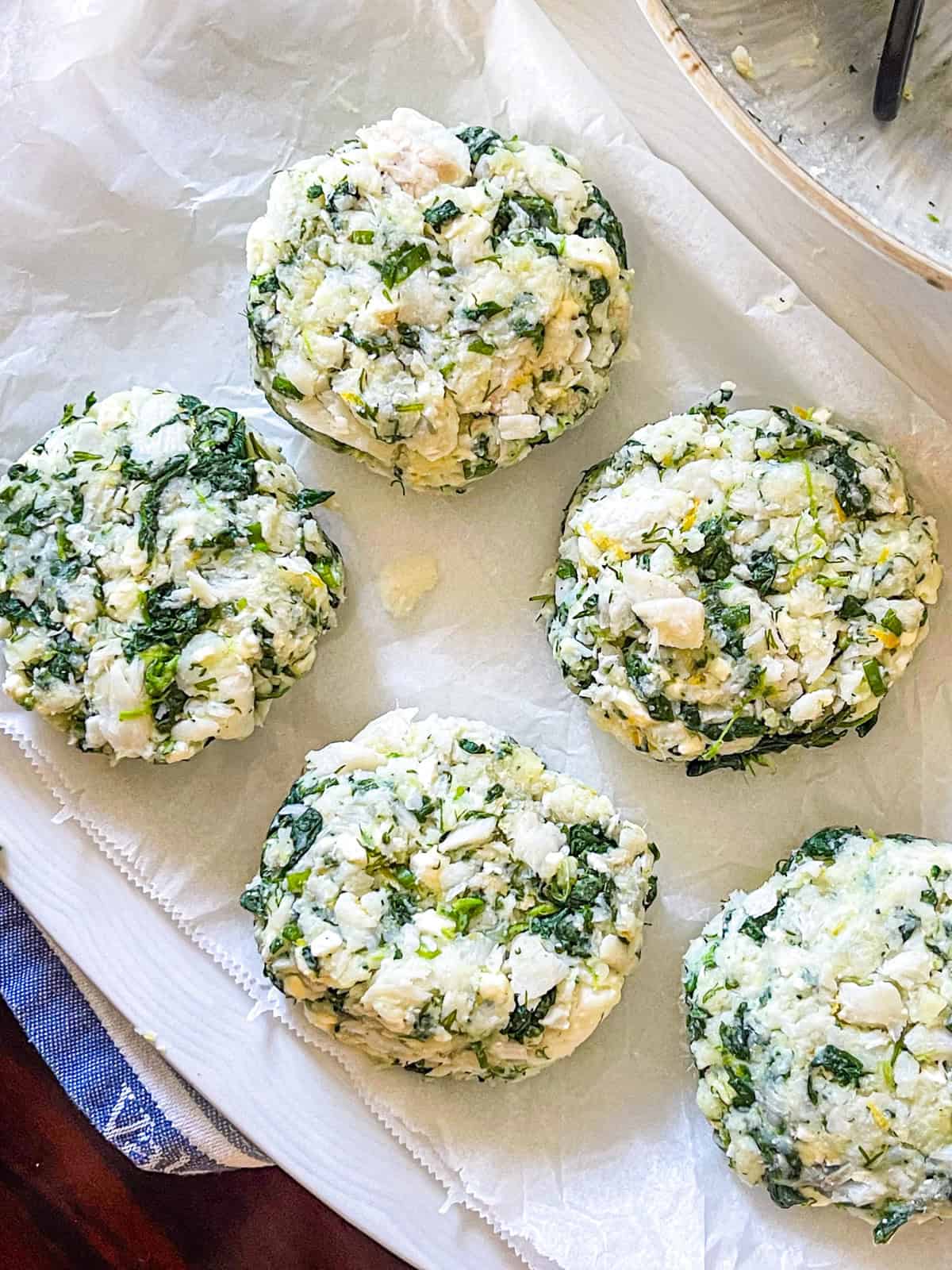 fish cakes places on a white platter.