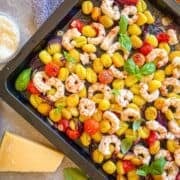 Sheet pan full of shrimp, gnocchi.