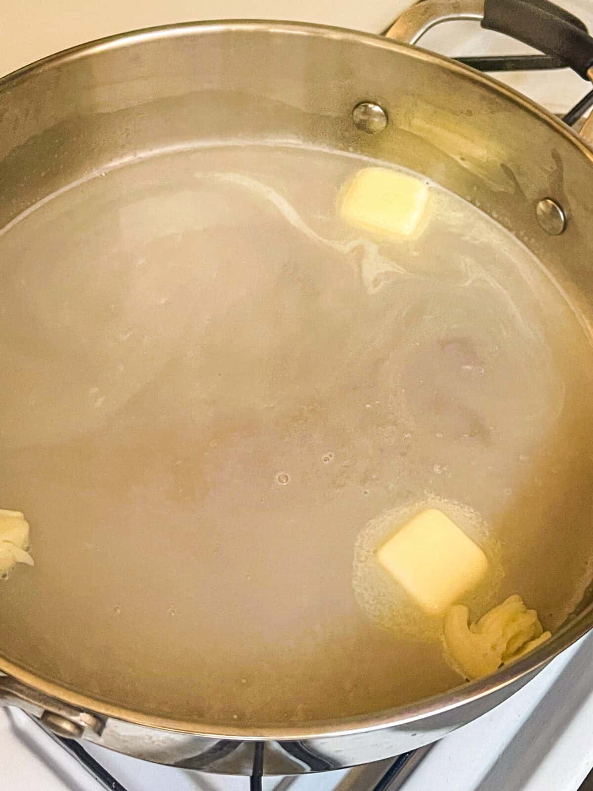 Butter melted in a saucepan.