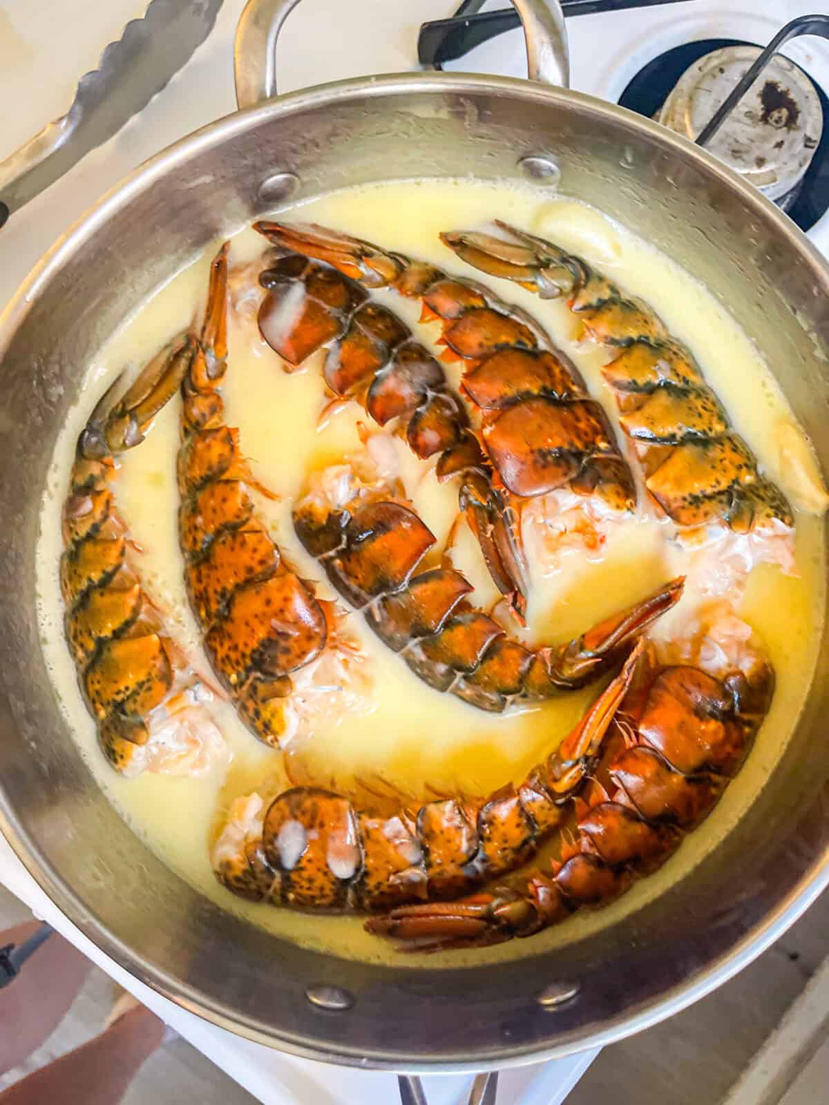 lobster being poached in butter.