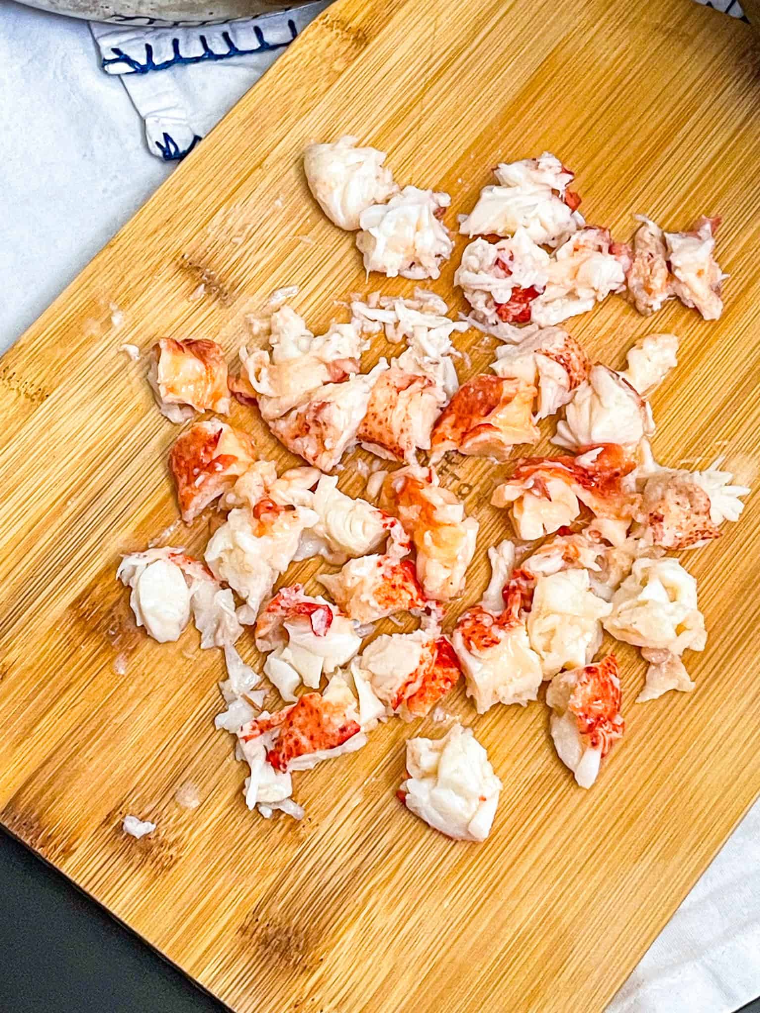 lobster meat on a board.