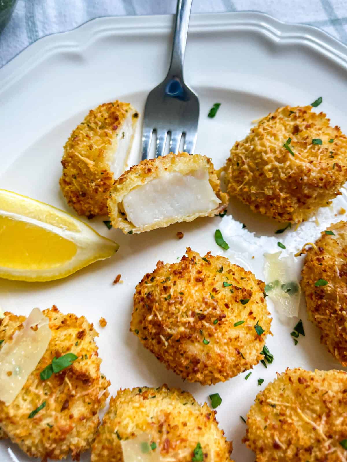 Air fryer scallops on a plate with a fork.