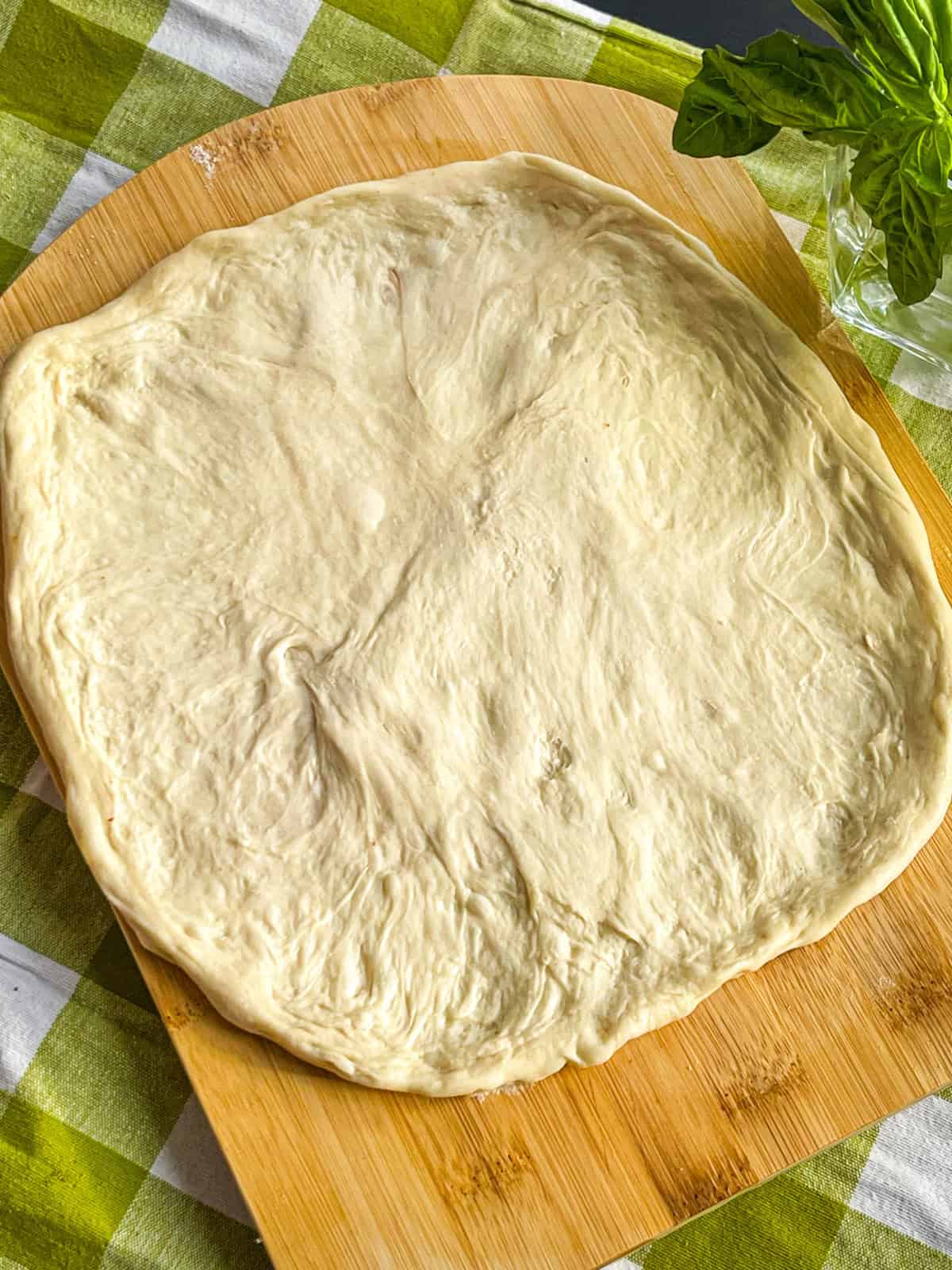 Dough stretched on a board.