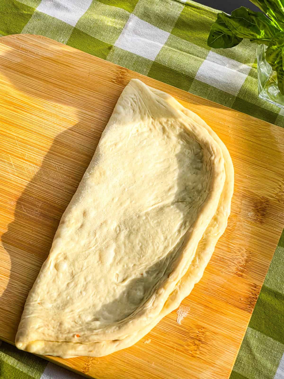 Dough folded into half.