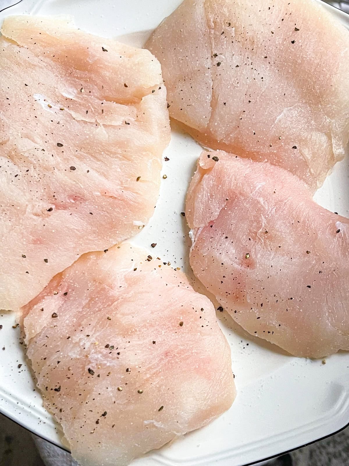 4 pieces of season halibut cheeks.