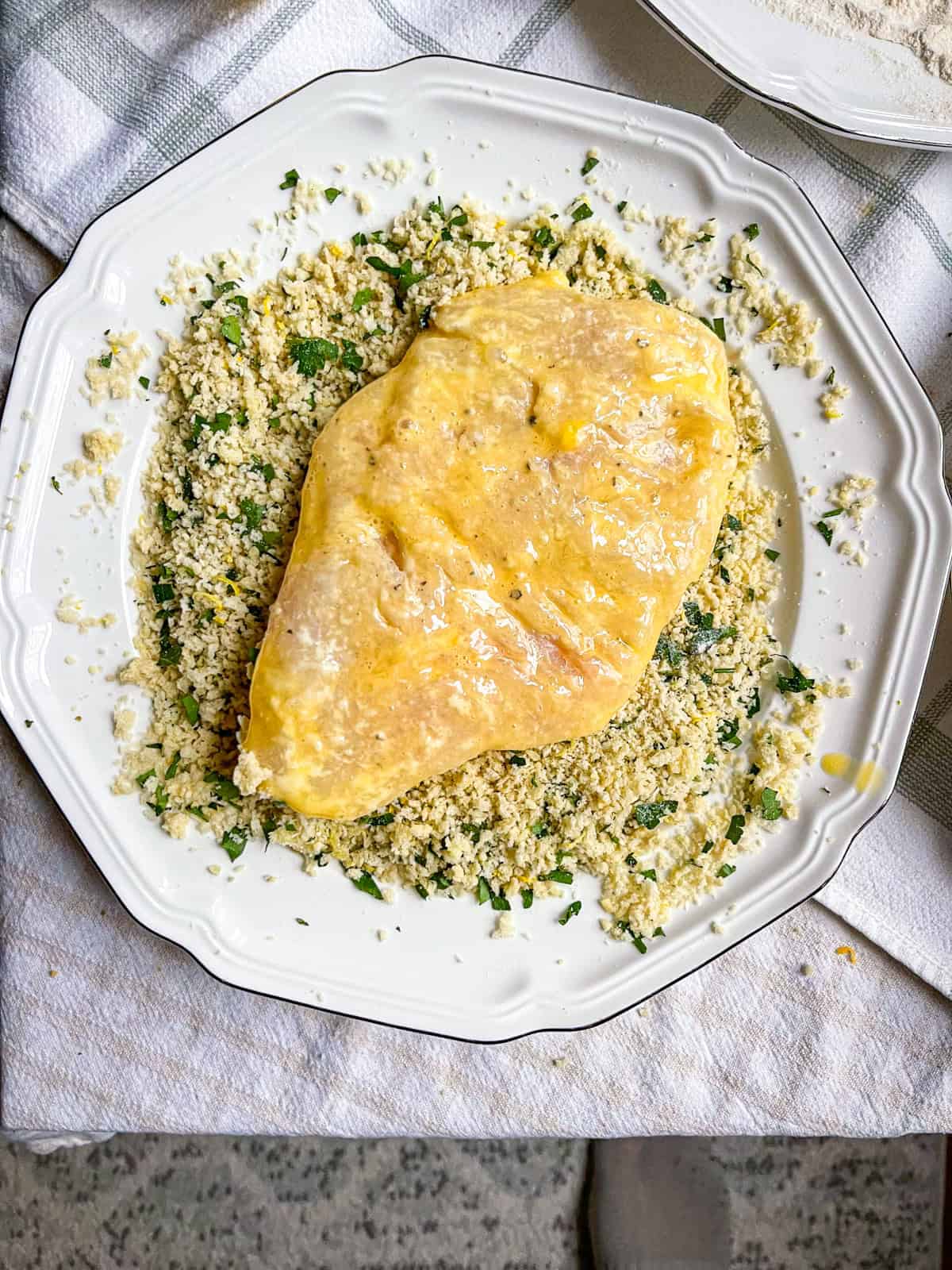halibut cheek with egg wash set in breadcrumbs.