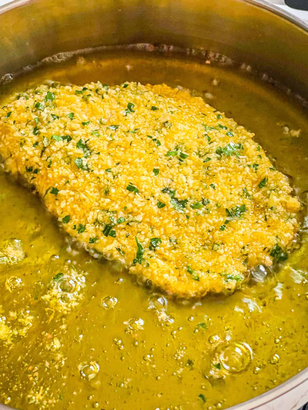 Halibut cutlet in oil.