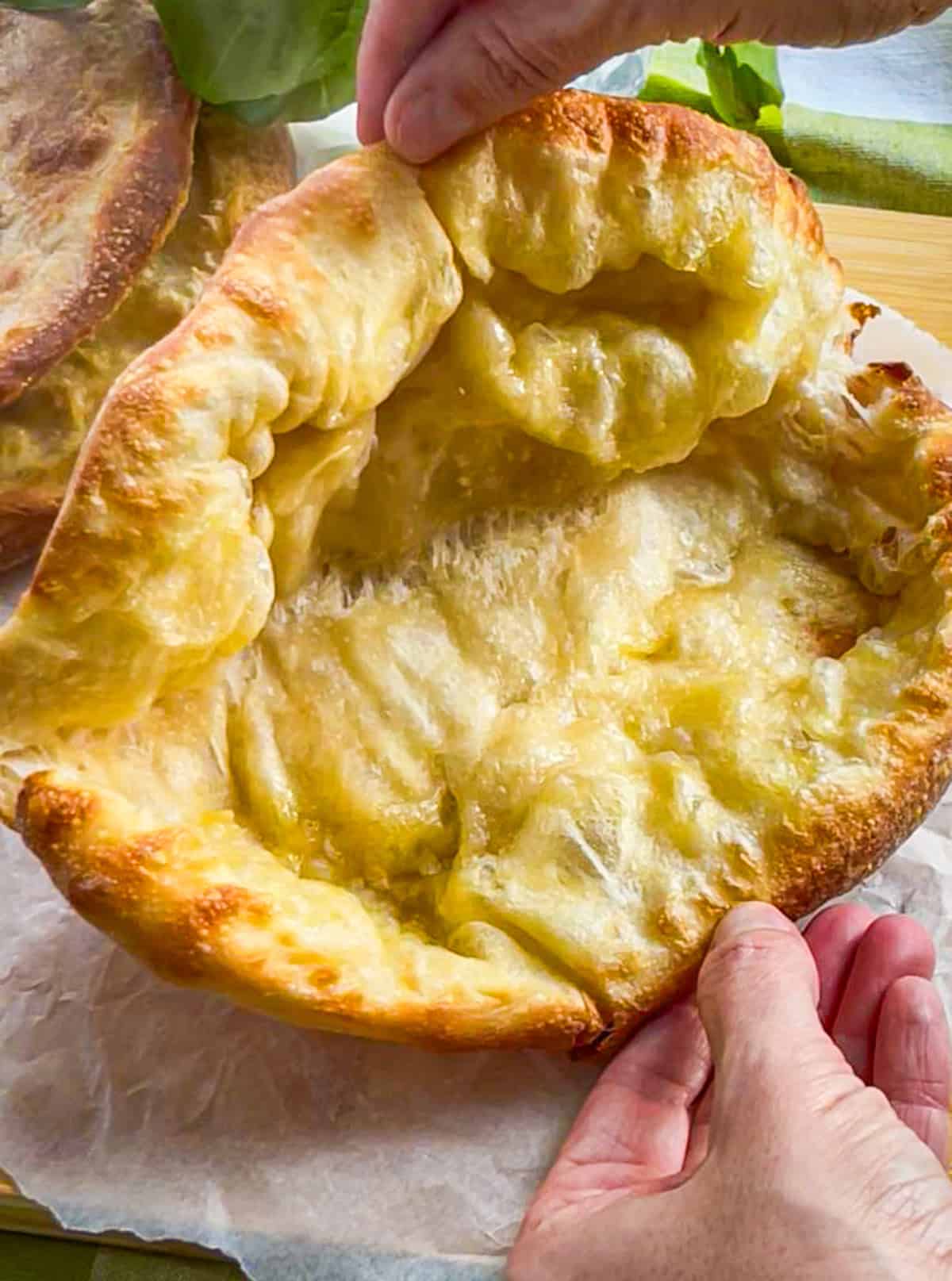 Sandwich dough spread open into half.